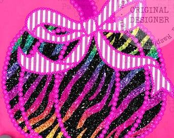 May include: A bright pink t-shirt featuring a pumpkin design. The pumpkin has a zebra print pattern with rainbow stripes and is outlined with pink glitter. A white striped bow is on top. The shirt has the text "COMFORT COLORS".