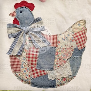 May include: A fabric chicken applique with a patchwork design. The chicken features a blue denim body, red comb, and a bow. The design includes the text "ORIGINAL DESIGNER". The background is a soft, off-white fabric.