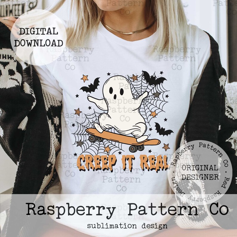 May include: White t-shirt featuring a cartoon ghost riding a skateboard, with bats, stars, and spiderwebs. The text "Creep It Real" is printed below the graphic. "Digital Download" is printed at the top left.