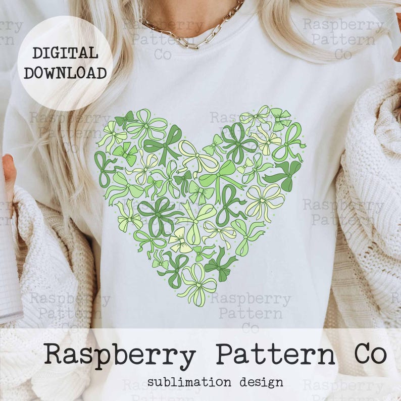 May include: A white t-shirt with a green heart-shaped design made of bows. The text "DIGITAL DOWNLOAD" is at the top of the shirt. The text "Raspberry Pattern Co" is at the bottom of the shirt.