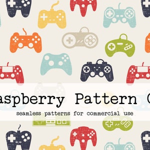 Op de afbeelding: Een herhalend patroon van kleurrijke videogamecontrollers in verschillende kleuren, waaronder blauw, groen, oranje en rood, op een crèmekleurige achtergrond. De tekst "Raspberry Pattern Co" staat eronder.