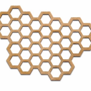 May include: A flat, light brown, laser-cut wooden panel featuring a repeating honeycomb pattern of interconnected hexagonal cutouts. The structure is irregular in shape, resembling a cluster of cells with a smooth, matte finish throughout.
