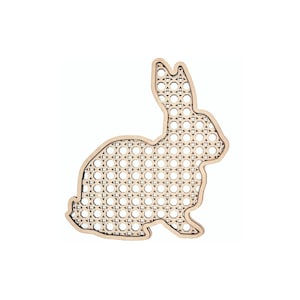 May include: A wooden rabbit-shaped craft kit with a woven pattern. The kit is made of natural wood and has a light brown color.