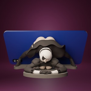 May include: A 3D-printed figurine of a character in a black dress and white hair, with a blindfold, posed in front of a blue rectangle. The figure is on a gray circular base, with a purple background.