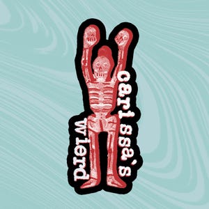 May include: Red skeleton figure with raised arms, wearing a black outline. The text "s'ass,  cert tubo" is written vertically on the right side of the figure. The text "DIETW" is written vertically on the left side of the figure.