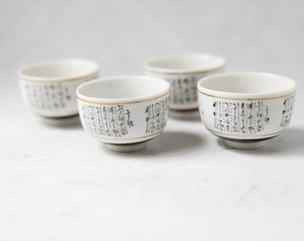 Japan sake or tea cups porcelain set of 4 white black gold four ounces