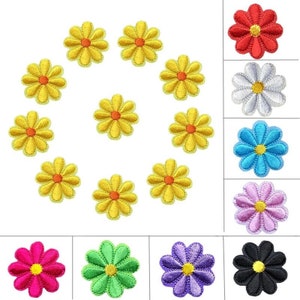 May include: Ten yellow embroidered flower patches with orange centres, surrounded by a circle of ten different coloured flower patches. The colours include red, white, blue, light blue, pink, green, purple, and black.