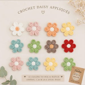 May include: Twelve crochet daisy appliqués in various colors including white, pink, orange, yellow, blue, green, brown, and red. Each flower has six petals and a contrasting center. The text reads CROCHET DAISY APPLIQUÉS, 12 COLORS TO MIX & MATCH, 0.6 INCH WIDE.