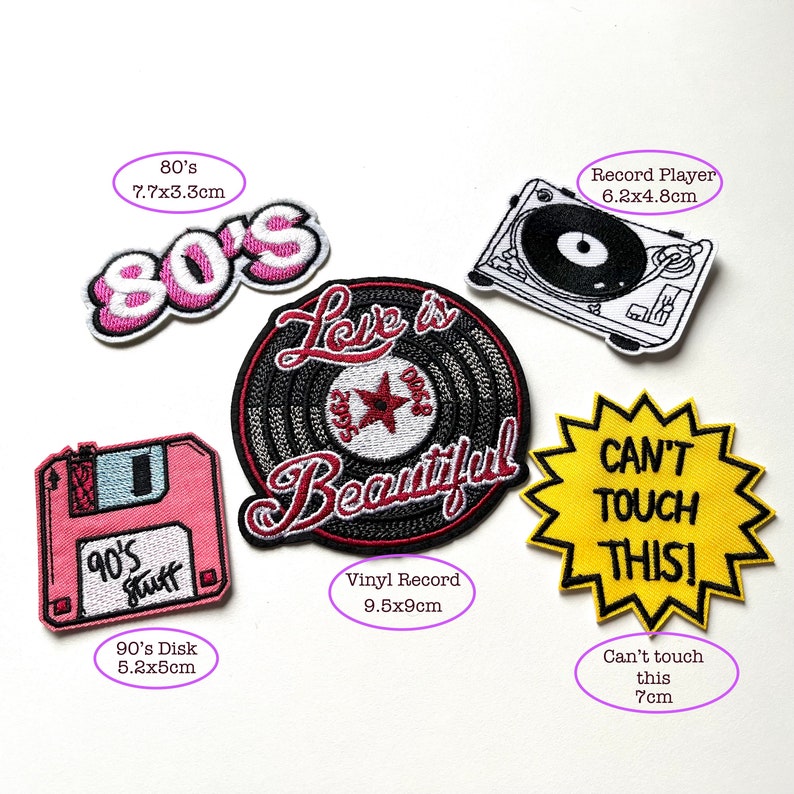 May include: A set of iron-on patches featuring 80's and 90's themed designs. The patches include a pink 80's logo, a black and white vinyl record with the text "Love is Beautiful", a pink floppy disk with the text "90's Stuff", a black and white record player, and a yellow starburst with the text "Can't Touch This!"