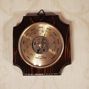 Wall barometer burned wood textured weather forecast instrument