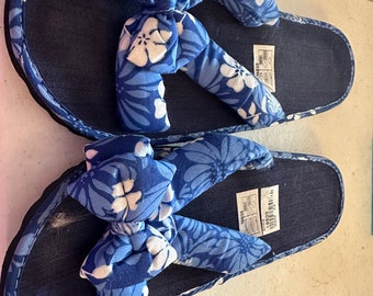 Blue and white flip flops