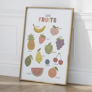 May include: A colorful educational poster featuring illustrations of various fruits with French names. The poster includes a pineapple, banana, strawberry, peach, grapes, apple, pear, cherry, blueberry, watermelon, orange, and lime.