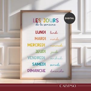 May include: A wooden framed print featuring the French text "LES JOURS de la semaine" in rainbow colours. The days of the week are displayed in a bold font with a cursive version below. A digital download is indicated.