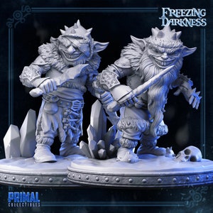 May include: Two gray painted miniature figures of goblins with sharp teeth and menacing expressions. They are holding daggers and are standing on a gray base with a skull. The text "Freezing Darkness" is in the upper right corner of the image.