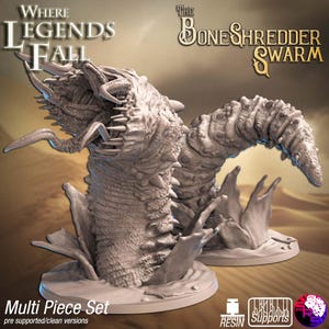 May include: A multi-piece resin set featuring two detailed, monstrous worm-like creatures. The creatures have textured skin, sharp teeth, and are emerging from a sandy base. The text "Where Legends Fall" and "The BoneShredder Swarm" are visible.