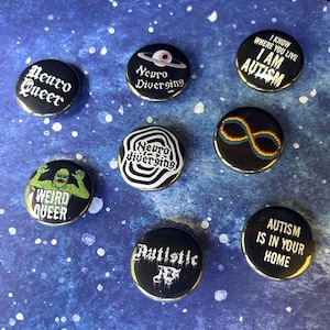 May include: A collection of ten black and white button pins with various designs and text related to neurodiversity and autism. The pins feature phrases like "Neuro Queer", "Neuro Diverging", "I Know Where You Live I Am Autism", "Weird Queer", "Autistic AF", and "Autism Is In Your Home".