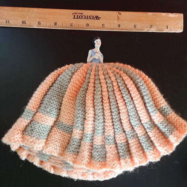 Antique porcelain half doll with knitted dress. Wool knitted dress, with a few moth holes. No cracks or chips.