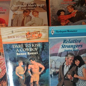 Group of 10 romance paperback books. Early 2000s era and back into 1980s. Assorted titles. Some have yellowing pages from age.