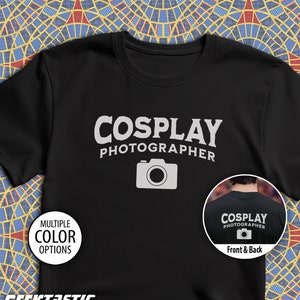 May include: Black t-shirt with the text "COSPLAY PHOTOGRAPHER" in white and a camera icon. The back of the shirt has the same text and icon.