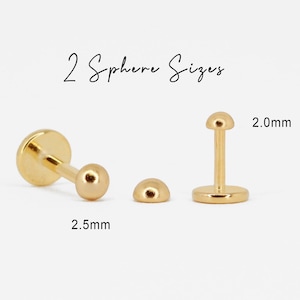 Puede incluir: Dos piezas de joyer&iacute;a corporal de color dorado con esferas de diferentes tama&ntilde;os. La esfera m&aacute;s peque&ntilde;a es de 2,0 mm y la m&aacute;s grande de 2,5 mm.