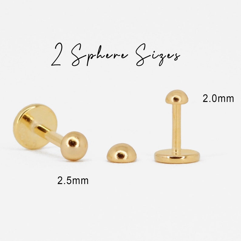 Puede incluir: Dos piezas de joyer&iacute;a corporal de color dorado con esferas de diferentes tama&ntilde;os. La esfera m&aacute;s peque&ntilde;a es de 2,0 mm y la m&aacute;s grande de 2,5 mm.