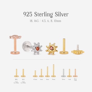 Op de afbeelding: Een set van 925 sterling zilveren zonvormige lichaamsieraden met een rode edelsteen in het midden. De sieraden zijn verkrijgbaar in verschillende maten en diktes, waaronder 18 gauge, 16 gauge, 4,5 mm, 6 mm, 8 mm en 10 mm. De sieraden zijn ook verkrijgbaar in zilver, goud en ros&eacute; goud.