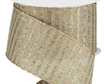 May include: A roll of decorative ribbon with a white core. The ribbon is beige with vertical gold glitter stripes. The ribbon is approximately 2.5 inches wide and is ideal for gift wrapping, crafting, and holiday decorations.