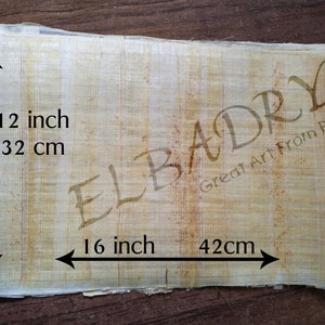 May include: A sheet of beige papyrus measuring 16 inches by 12 inches, or 42 cm by 32 cm. The papyrus has a natural, slightly rough texture. The words "ELBADRY Great Art From Past" are printed in brown ink in the upper right corner.