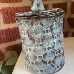 Small canisters, lidded jars