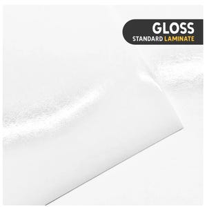 May include: A sheet of white material with a smooth, reflective surface finish. A black rectangular label in the upper right corner features the white text GLOSS and the yellow text STANDARD LAMINATE, indicating the material type.