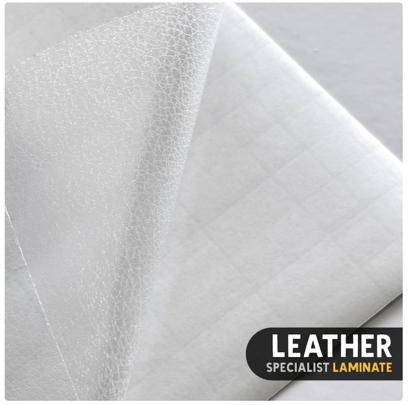 May include: A white sheet of leather specialist laminate with a textured surface partially peeled back to reveal a grid-patterned adhesive backing. The bottom right corner features a black label with the white and yellow text LEATHER SPECIALIST LAMINATE.