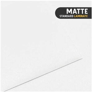 May include: A solid white sheet of material with a smooth, non-reflective surface. In the upper right corner, a black rectangular label with rounded corners features the white text MATTE and the yellow text STANDARD LAMINATE.