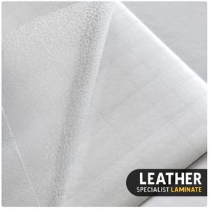 May include: A white sheet of leather specialist laminate with a textured surface partially peeled back to reveal a grid-patterned adhesive backing. The bottom right corner features a black label with the white and yellow text LEATHER SPECIALIST LAMINATE.
