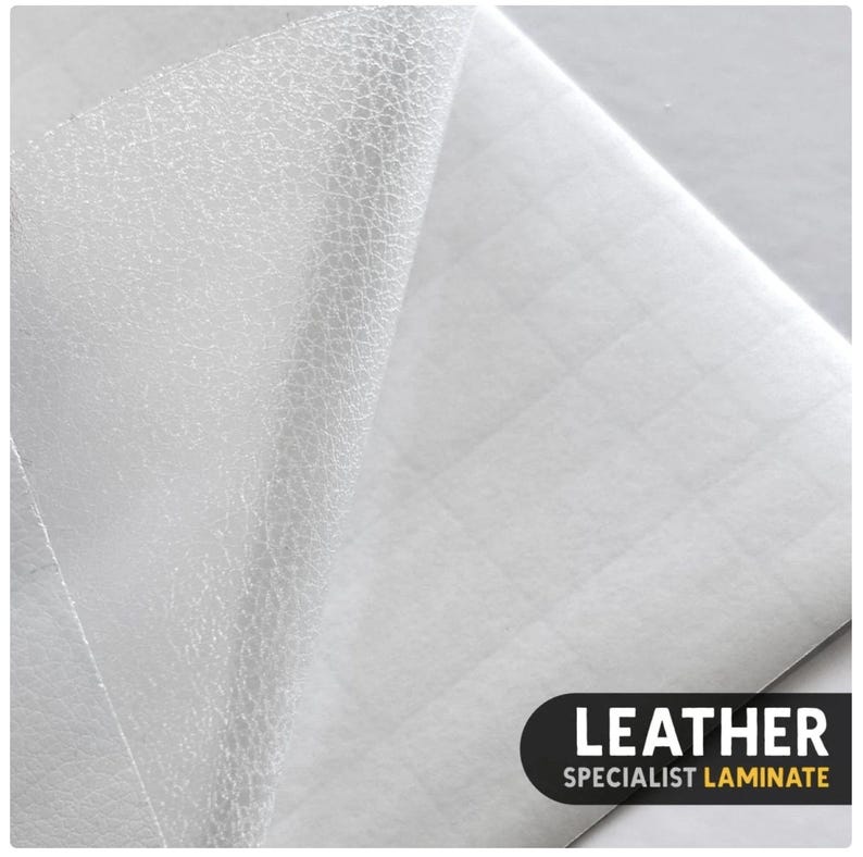 May include: A white sheet of leather specialist laminate with a textured surface partially peeled back to reveal a grid-patterned adhesive backing. The bottom right corner features a black label with the white and yellow text LEATHER SPECIALIST LAMINATE.