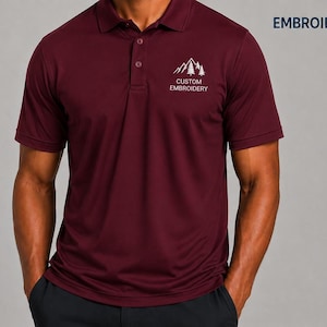 A man wearing a burgundy polo shirt with a logo on the left side of the chest.