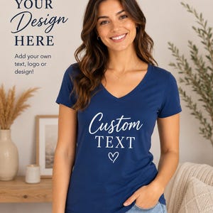 May include: Navy blue V-neck t-shirt with the words "Custom TEXT" and a heart symbol. The shirt also features the text "YOUR Design HERE" and "Add your own text, logo or design!"