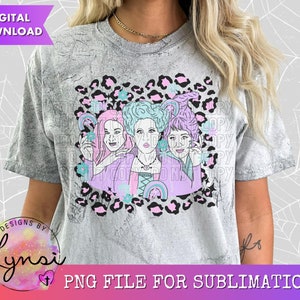 May include: Sublimation design featuring three women with pastel pink, purple, and blue hair wearing witch hats and holding wands. The design is set against a pink and black leopard print background with rainbows and stars.