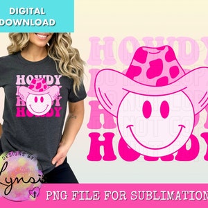 May include: Dark gray t-shirt with a pink and white "Howdy" graphic featuring a smiley face wearing a pink cowboy hat. The design includes the text "Howdy" in a layered font. The image also includes the text "Digital Download" and "PNG File for Sublimation".