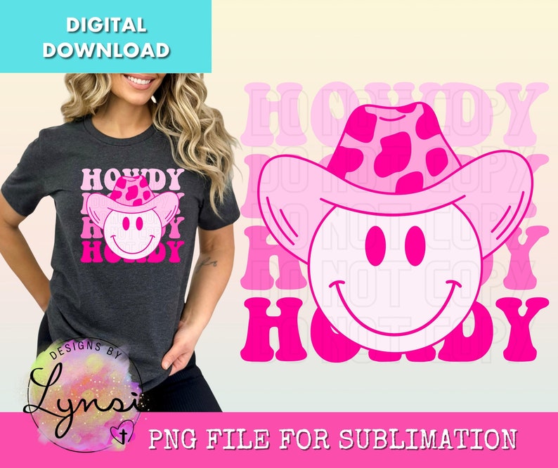May include: Dark gray t-shirt with a pink and white "Howdy" graphic featuring a smiley face wearing a pink cowboy hat. The design includes the text "Howdy" in a layered font. The image also includes the text "Digital Download" and "PNG File for Sublimation".