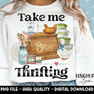May include: White sweatshirt with a vintage-style graphic. The design includes a bread box, bowls, a duck, and the text "Take me Thrifting." Additional text reads "PNG FILE - HIGH QUALITY - DIGITAL DOWNLOAD."
