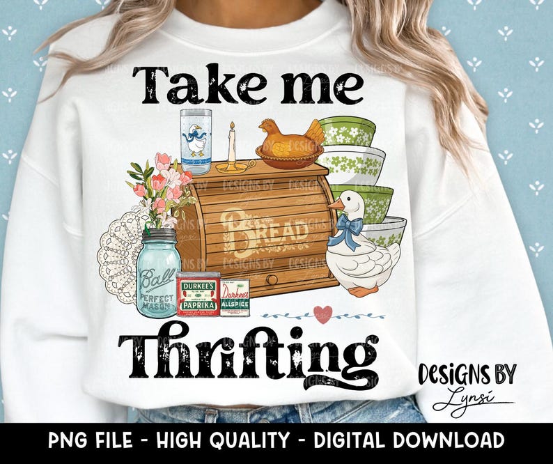 May include: White sweatshirt with a vintage-style graphic. The design includes a bread box, bowls, a duck, and the text "Take me Thrifting." Additional text reads "PNG FILE - HIGH QUALITY - DIGITAL DOWNLOAD."