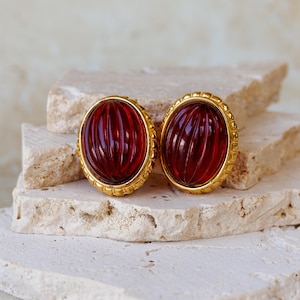 Vintage Richelieu statement clip-on earrings with Red Lucite Ribbed cabochon stones