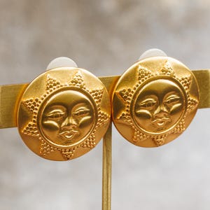 Vintage Anne Klein Couture Gold-tone Button Shaped Clip-On Earrings with a Celestial Design