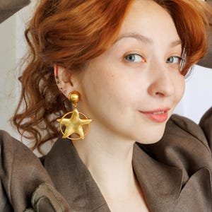Anne Klein Couture Star Shaped Matte Gold Tone Brushed Drop Dangle Clip On Earrings