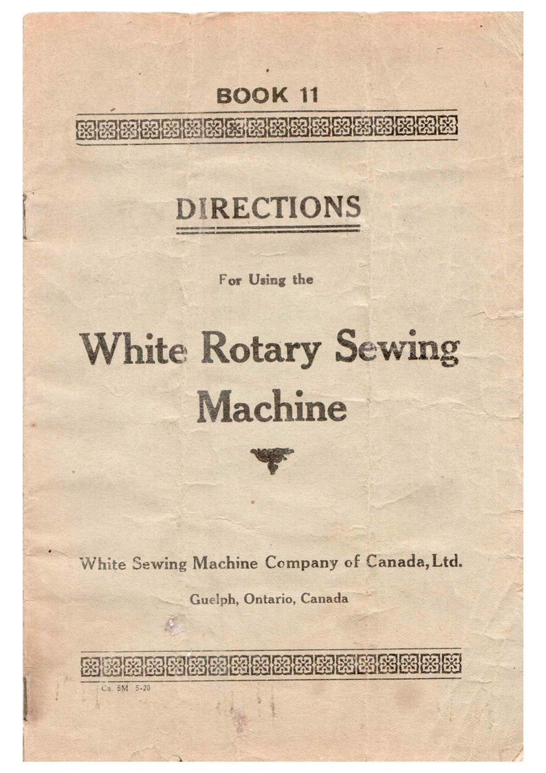 May include: A vintage book cover for a sewing machine manual. The cover is beige with black text that reads "Book 11" and "Directions for Using the White Rotary Sewing Machine". The text also includes the company name "White Sewing Machine Company of Canada, Ltd." and the location "Guelph, Ontario, Canada".