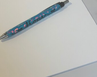 Ballpoint pen with a clip