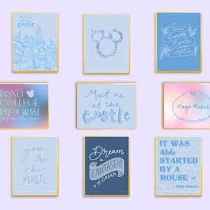 May include: Nine framed art prints with gold borders. The prints feature various quotes and illustrations in blue and white, including a castle, Mickey Mouse ears, and the text "Happily Ever After."