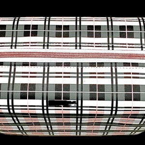 May include: A rectangular cosmetic bag with a plaid pattern in black, white, and gray. The bag has a red zipper and a black background. The plaid pattern is made up of intersecting lines that create a grid-like design.