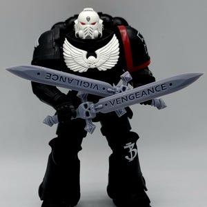 McFarlane Action Figure Vigilance and Vengeance twin power blades - Unique weapons for your custom toy upgrades.