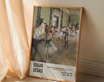 May include: A framed print of a painting by Edgar Degas titled "The Ballet Class". The painting depicts a group of ballerinas in a dance studio, with a male instructor in the background. The painting is in a light brown frame.